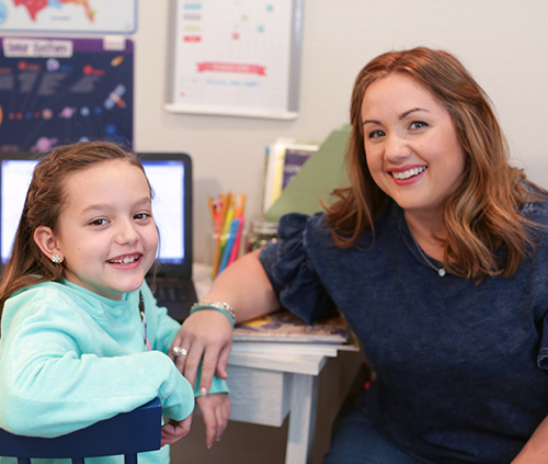 teacher and girl in the classroom